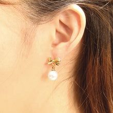 Load image into Gallery viewer, 14K Gold Dipped CZ Stone Paved Bow Pearl Dangle Earrings
